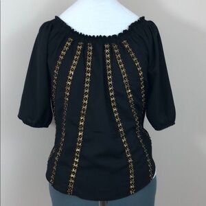 Black top with gold detail